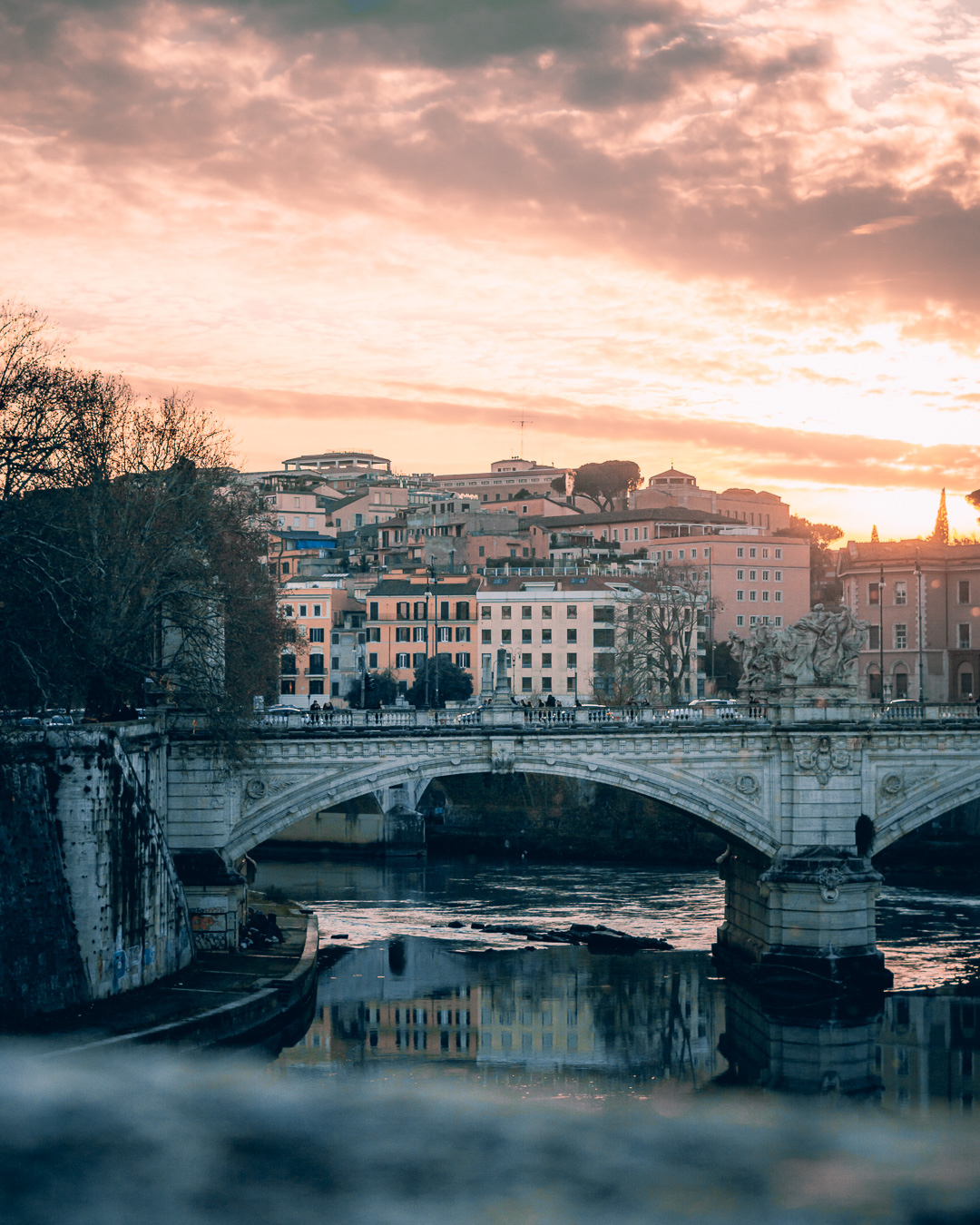 St Angelo bridge with a sunset in the background